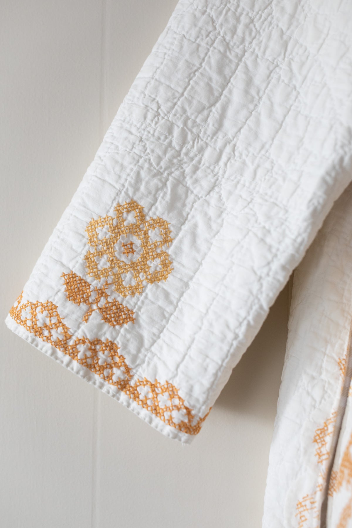 Gold cross stitch quilt jacket