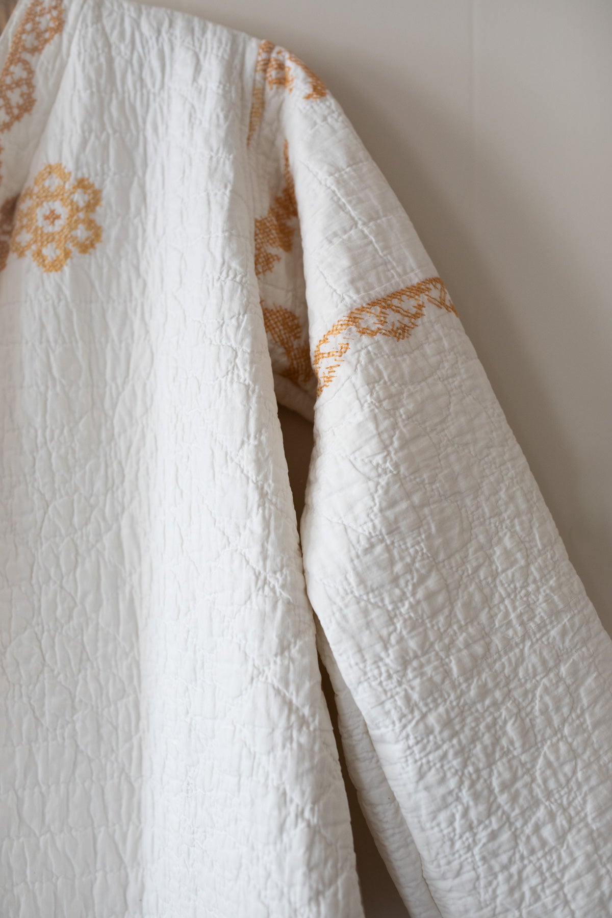 Gold cross stitch quilt jacket